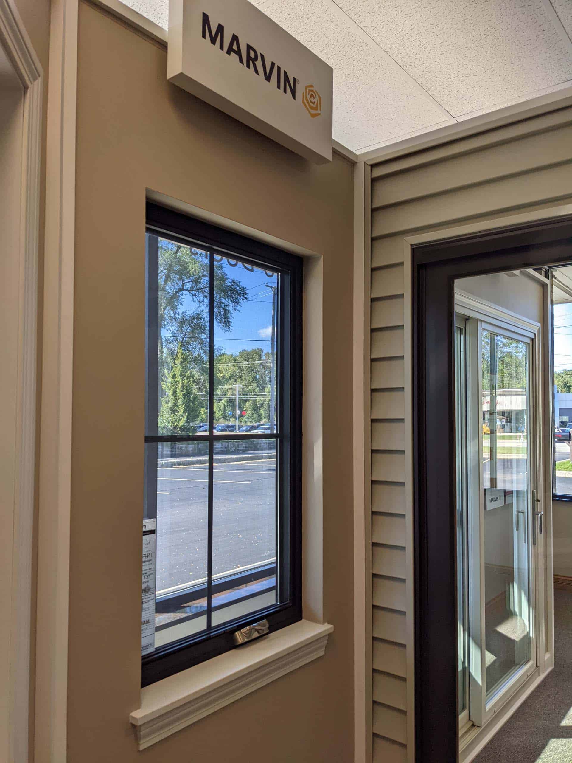 Commercial window with black trim, seen from the interior of a business foyer
