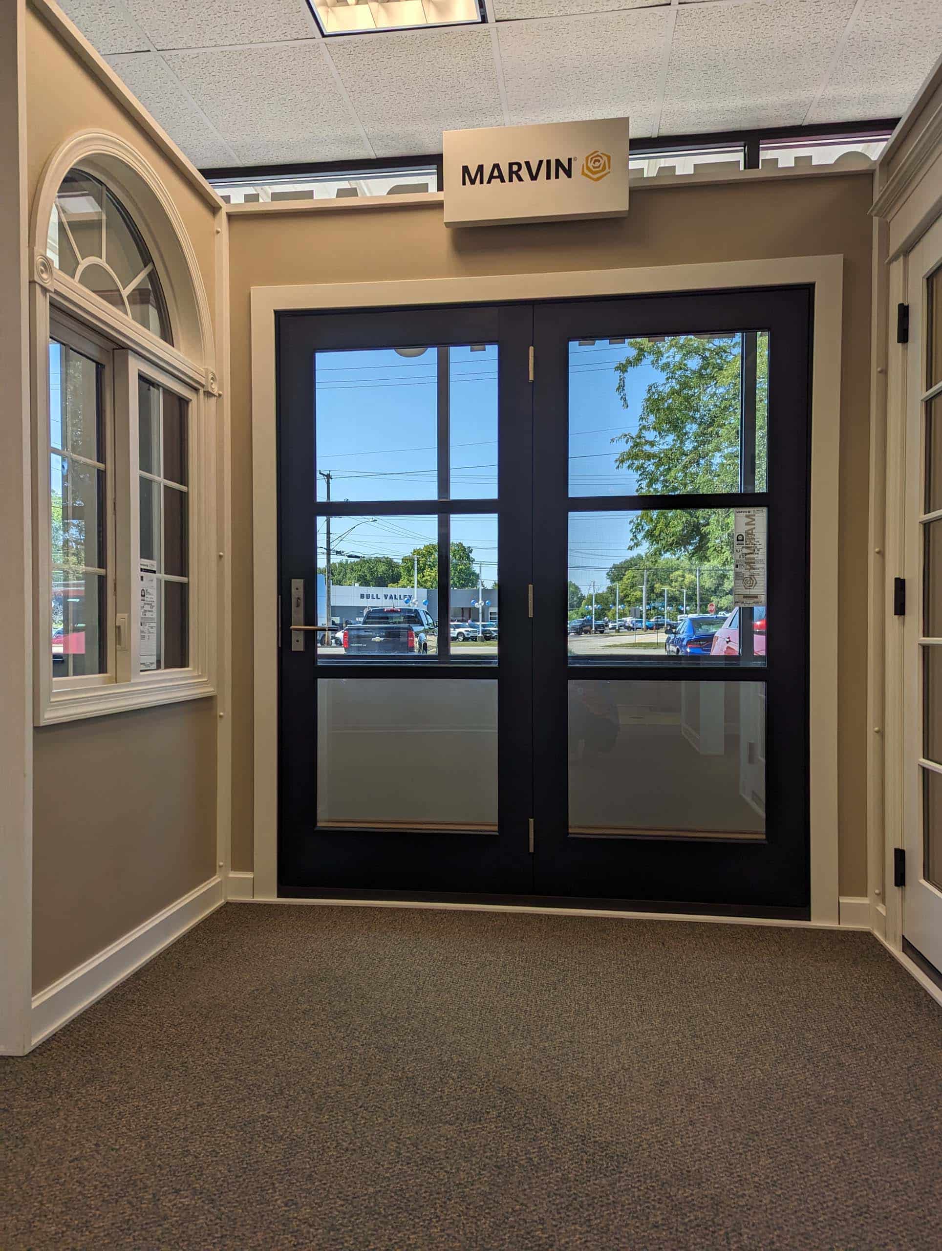 Commercial double doors with large transparent glass panels